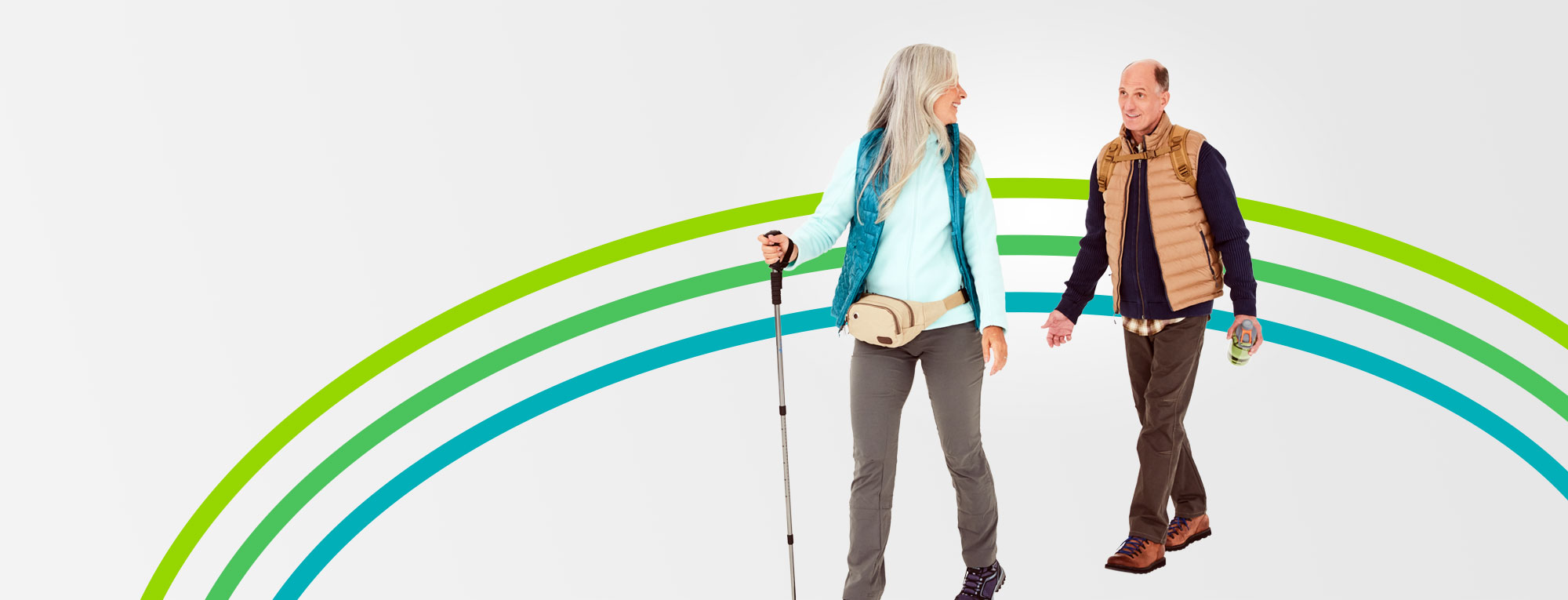 A happy retired couple on a hike featured in an article about retirement financial plan